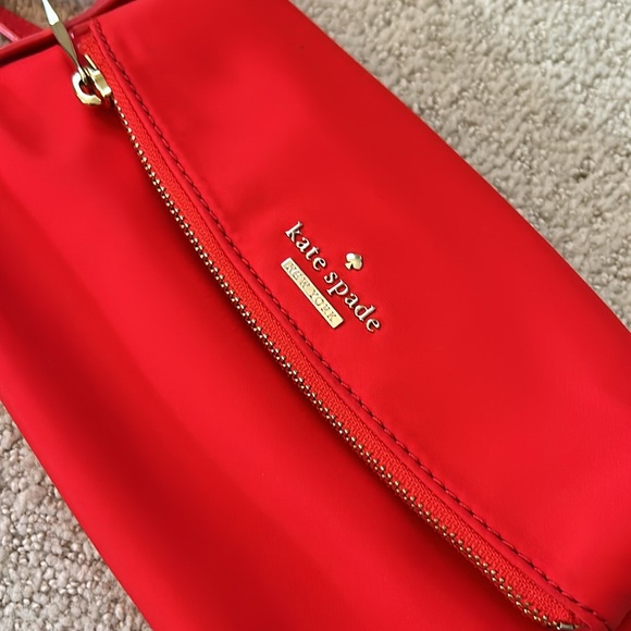 Kate Spade Red cross body purse. Fold over flap style. Zip pocket on front. - Picture 11 of 14